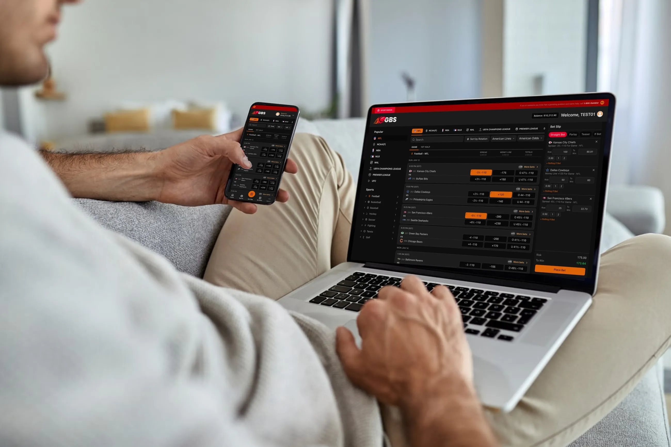 A bettor using the GBS sportsbook on a laptop and a phone